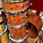 stacked cherry wood drum kit